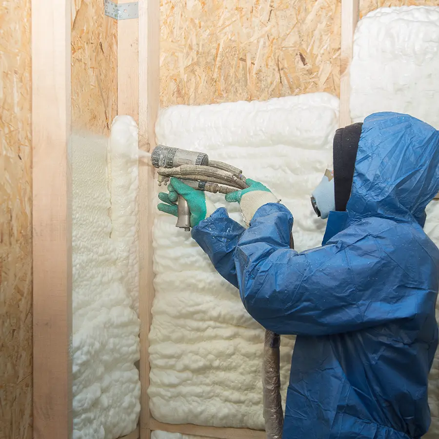 Foam is applied to the walls to warm the house